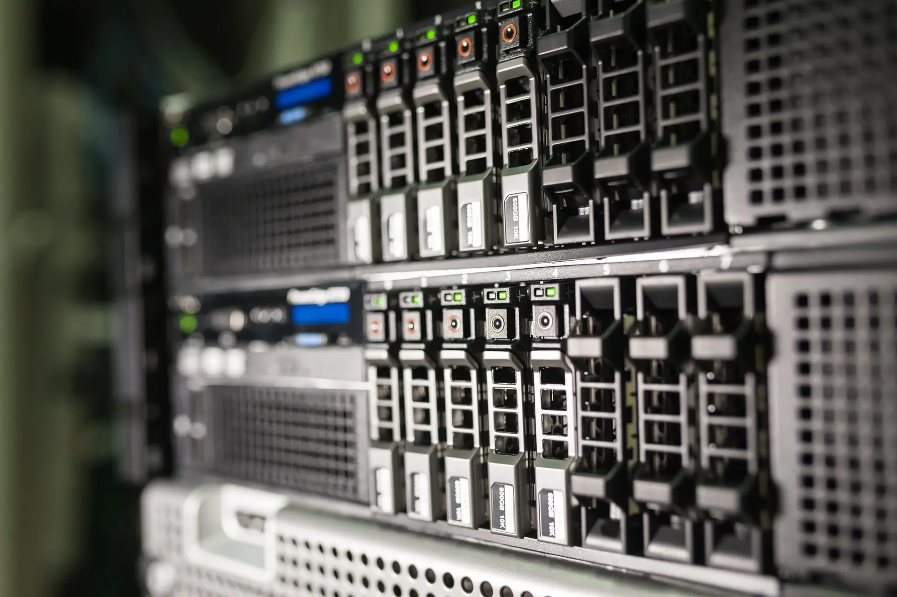 Close-up view of rack-mounted enterprise server hardware with multiple hard drive bays and status indicators