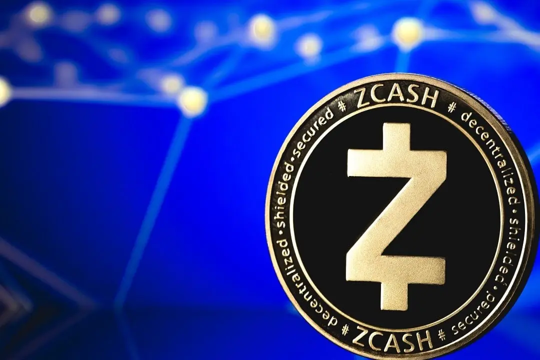 A physical Zcash ZEC cryptocurrency coin featuring the Z logo against a blurred blue digital network background